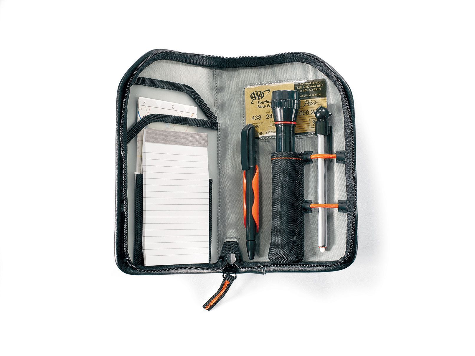 small black case with note pad, flashlight, air presure gage